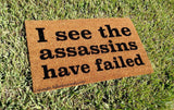 I See The Assassins Have Failed Welcome Door Mat - UnwelcomeDoormats - Custom doormats - Personalized doormats - Rude Doormats - Funny Doormats